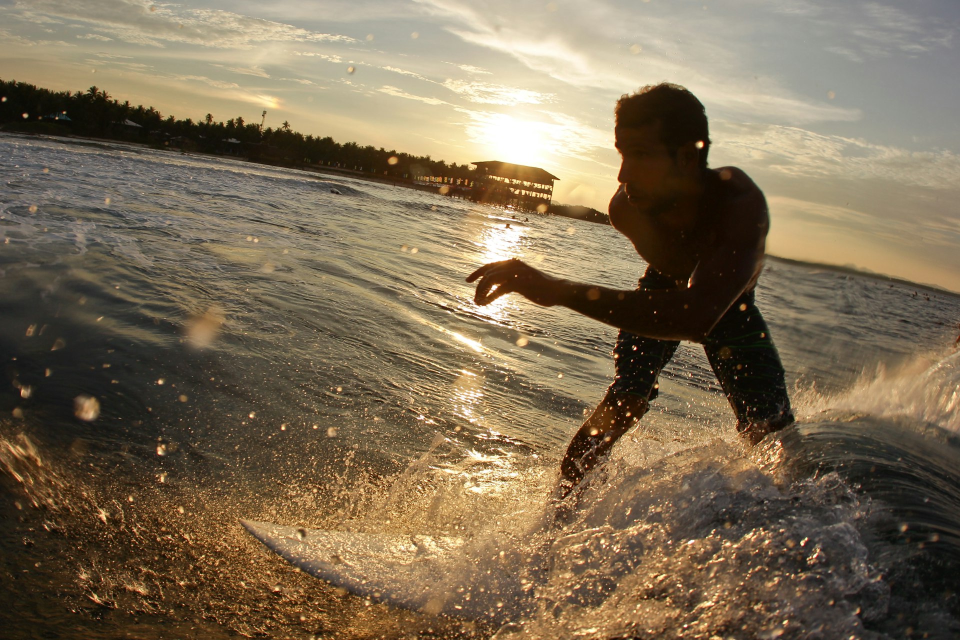 A surfer rides a wave in Siargao, the Philippines