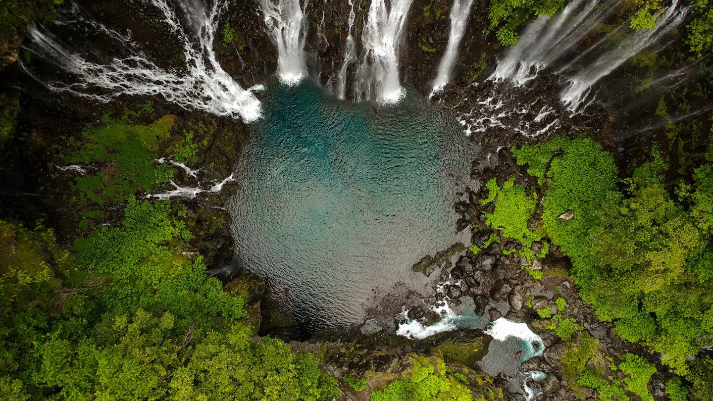 Bird eye view of the grand galet waterfall in reunion island ; Shutterstock ID 1715503237; Your name (First / Last): AnneMarie McCarthy; GL account no.: 56530; Netsuite department name: Digital Content-WIP; Full Product or Project name including edition: First time in Reunion Island
