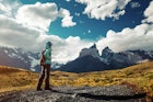 A female hiker on a trail at Torres del Paine National Park.