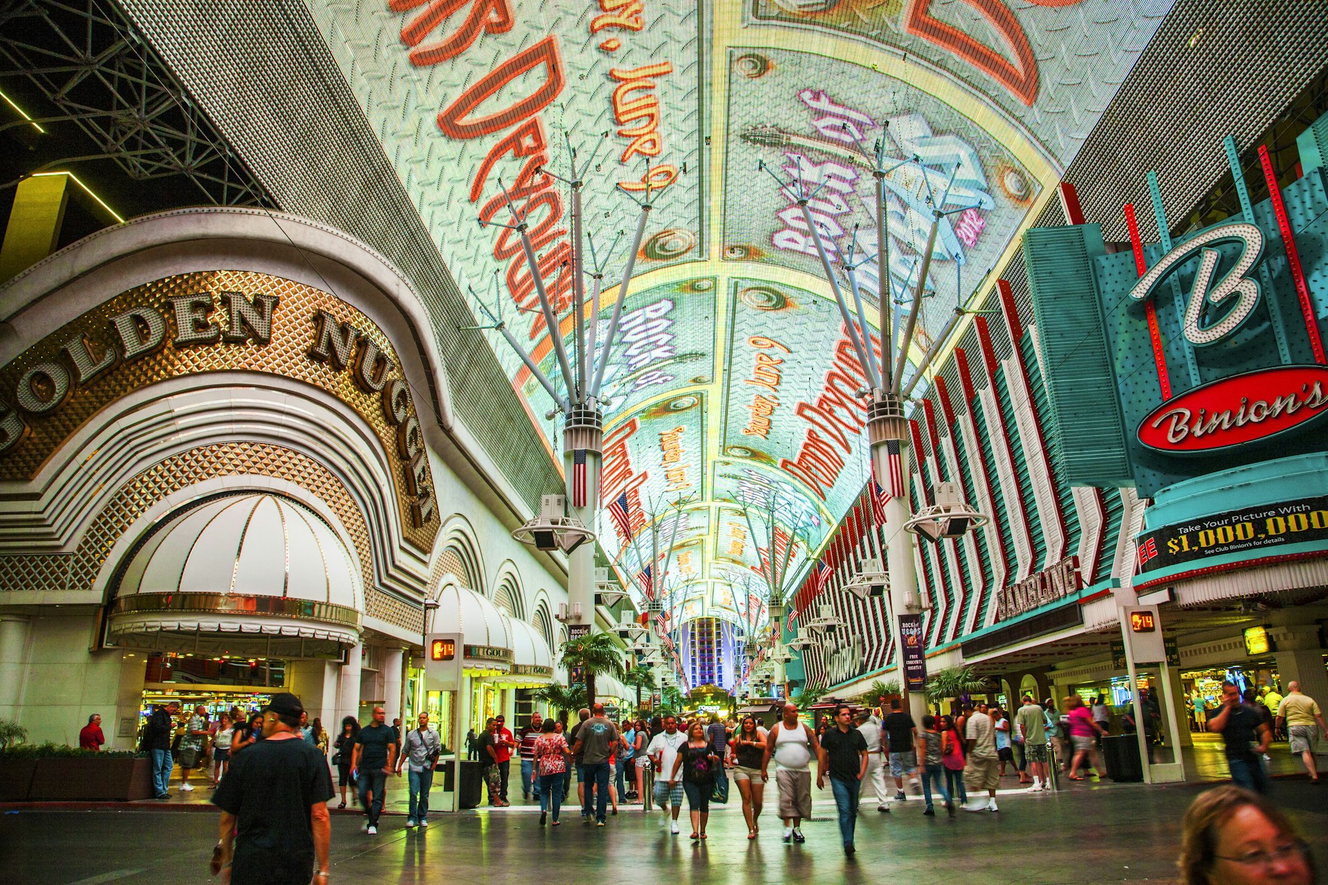 A wide shot of the people and casinos on Fremont St