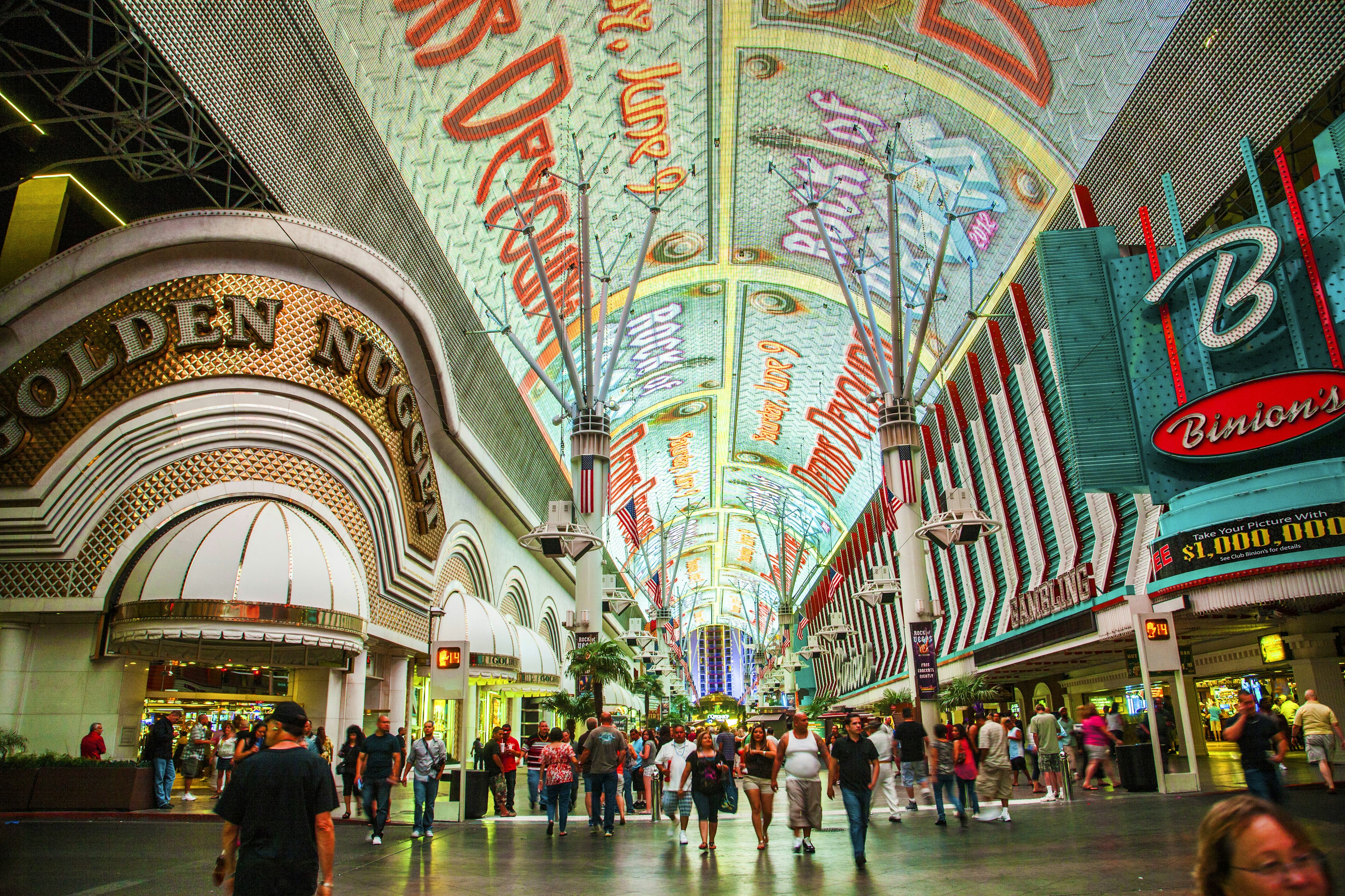 A wide shot of the people and casinos on Fremont St