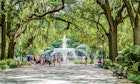 SAVANNAH, GEORGIA - June 7, 2014:  Park fountain with tourists in Savannah, Georgia.