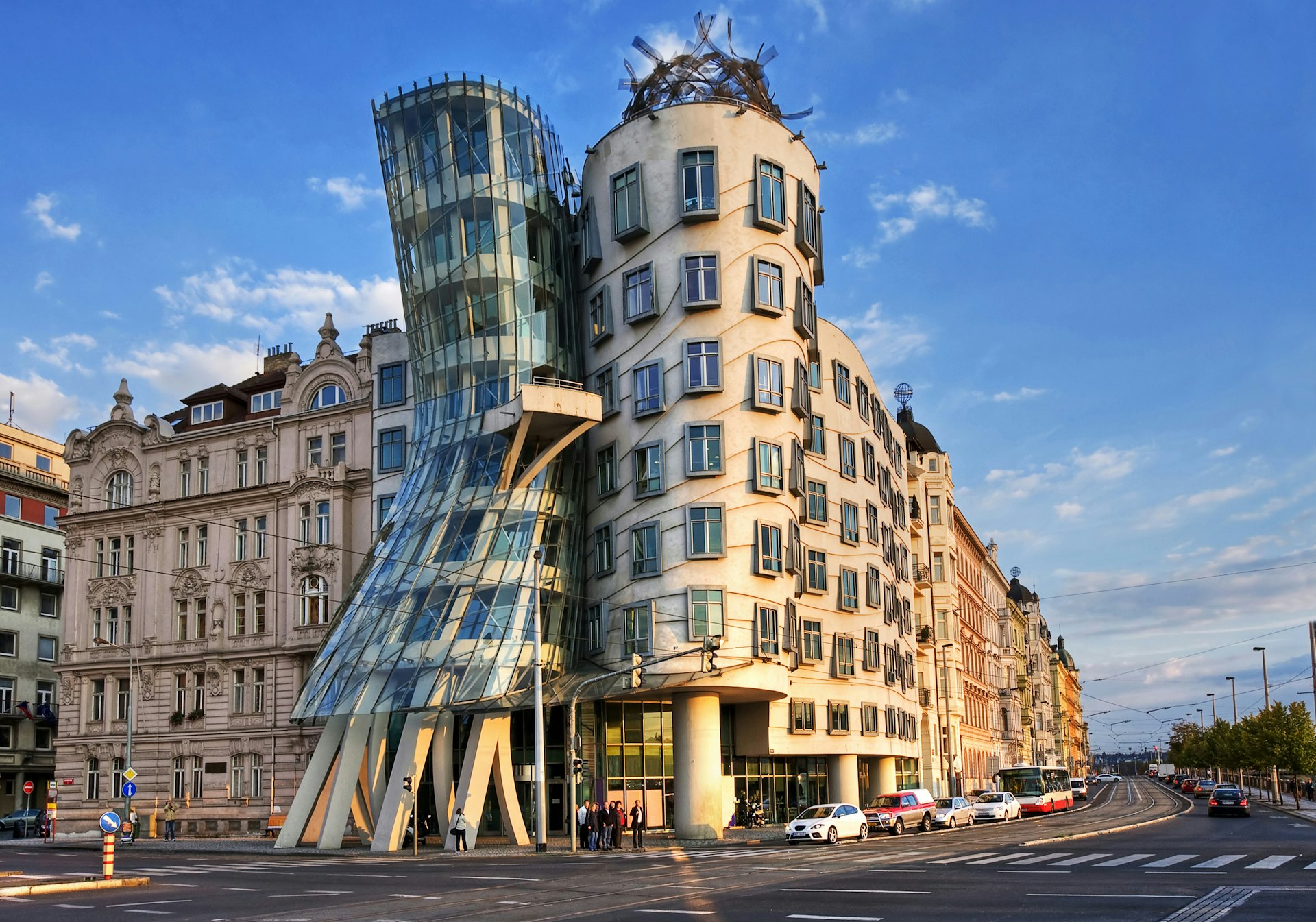 The Dancing House, a modern piece of architecture designed by Vlado Milunic and Frank Gehry in Prague, sees one building squish into another artistically
