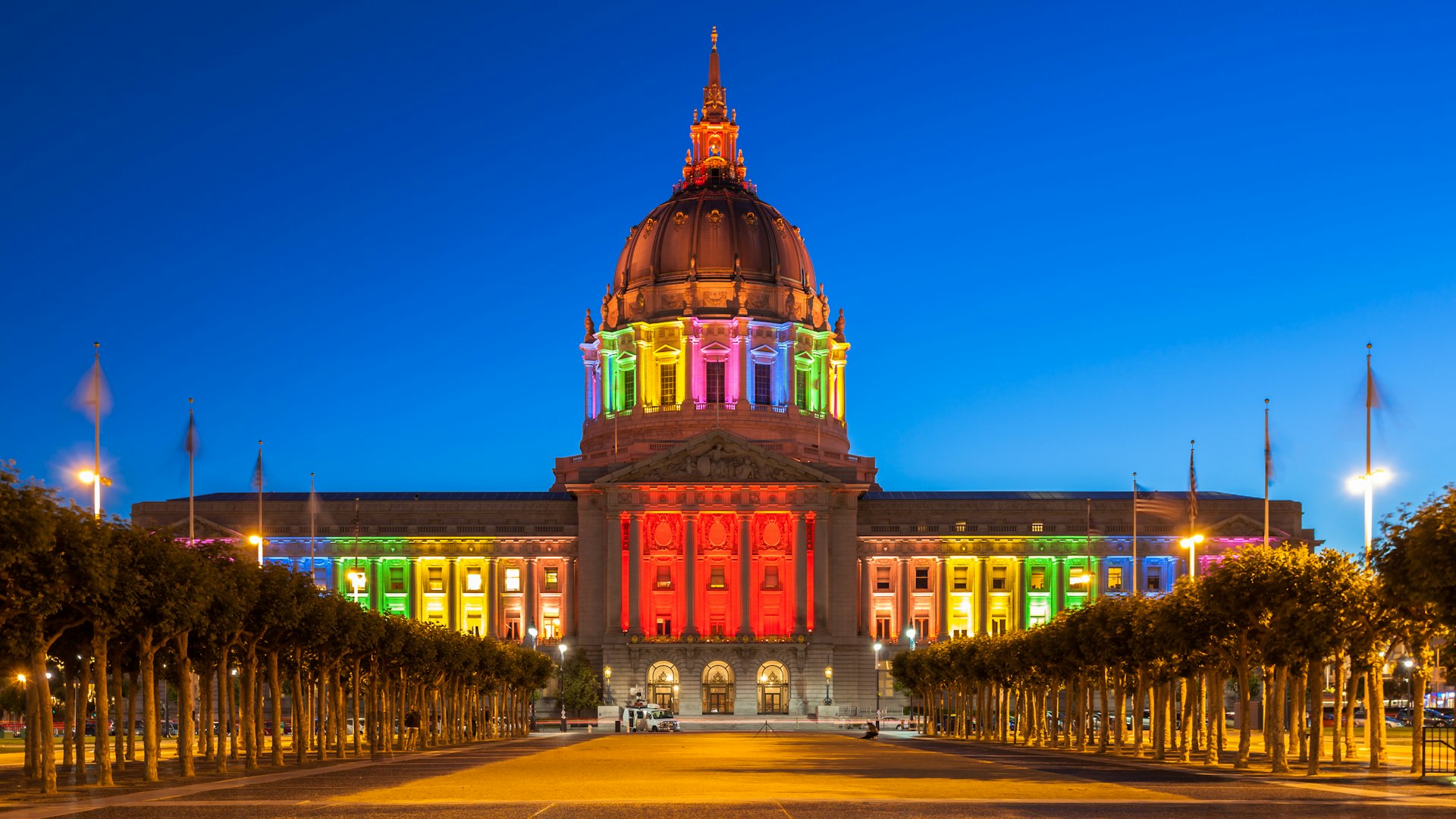 San Francisco City Hall illuminated in rainbow colors in honor of Pride Week
