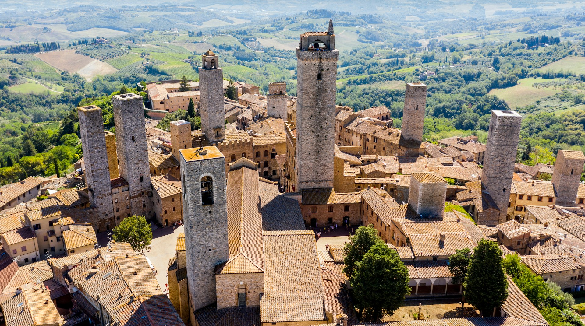 Aerial of the medieval town of San Gimignano, with 10 distinctive stone towers rising above the town
