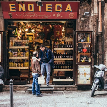 NAPLES, ITALY - MARCH 20, 2015: Range of the wine shop on the old popular street in Naples, Italy