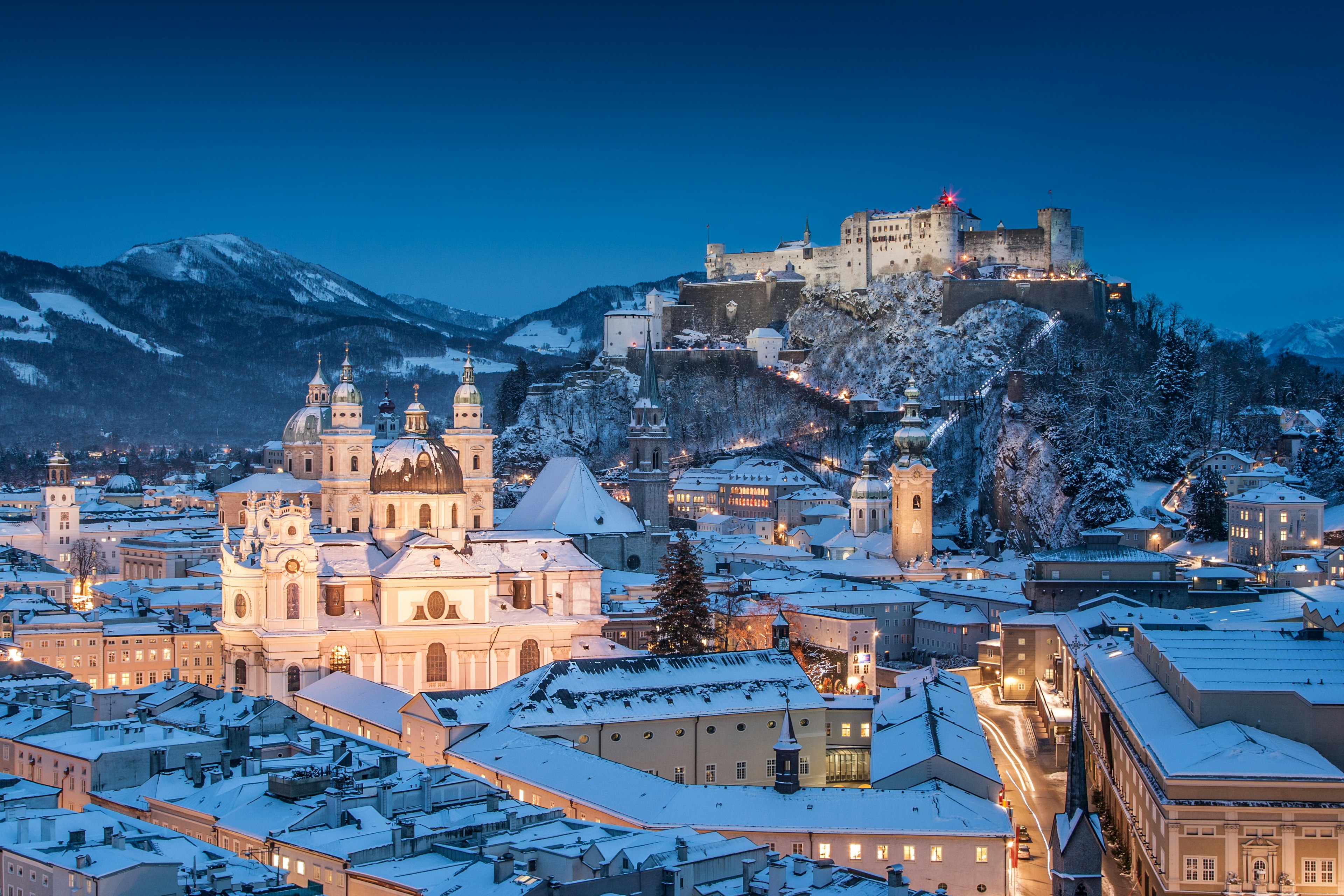 Historic city of Salzburg illuminated in the snow at Christmas