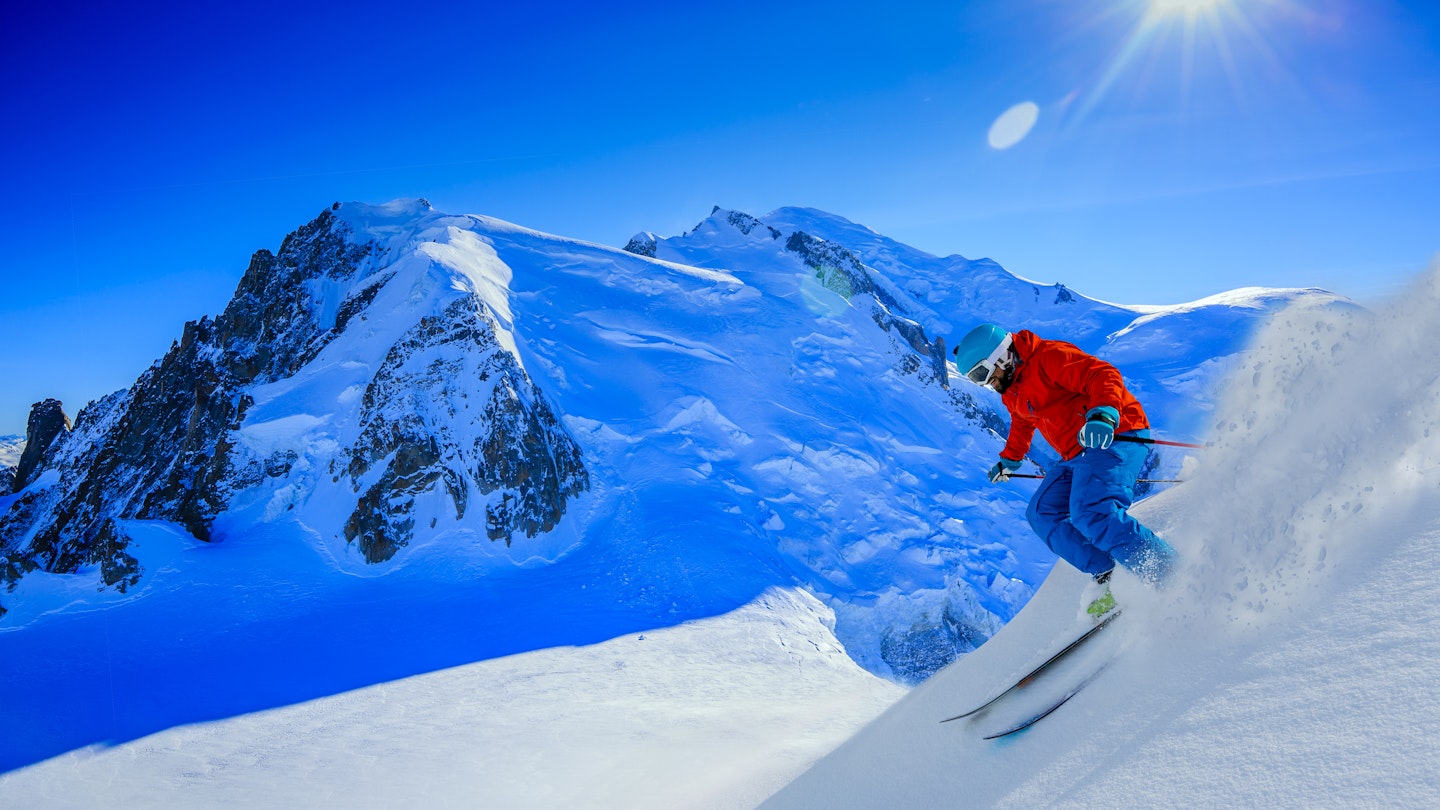 Man skiing down a steep slope in the Chamonix Valley.