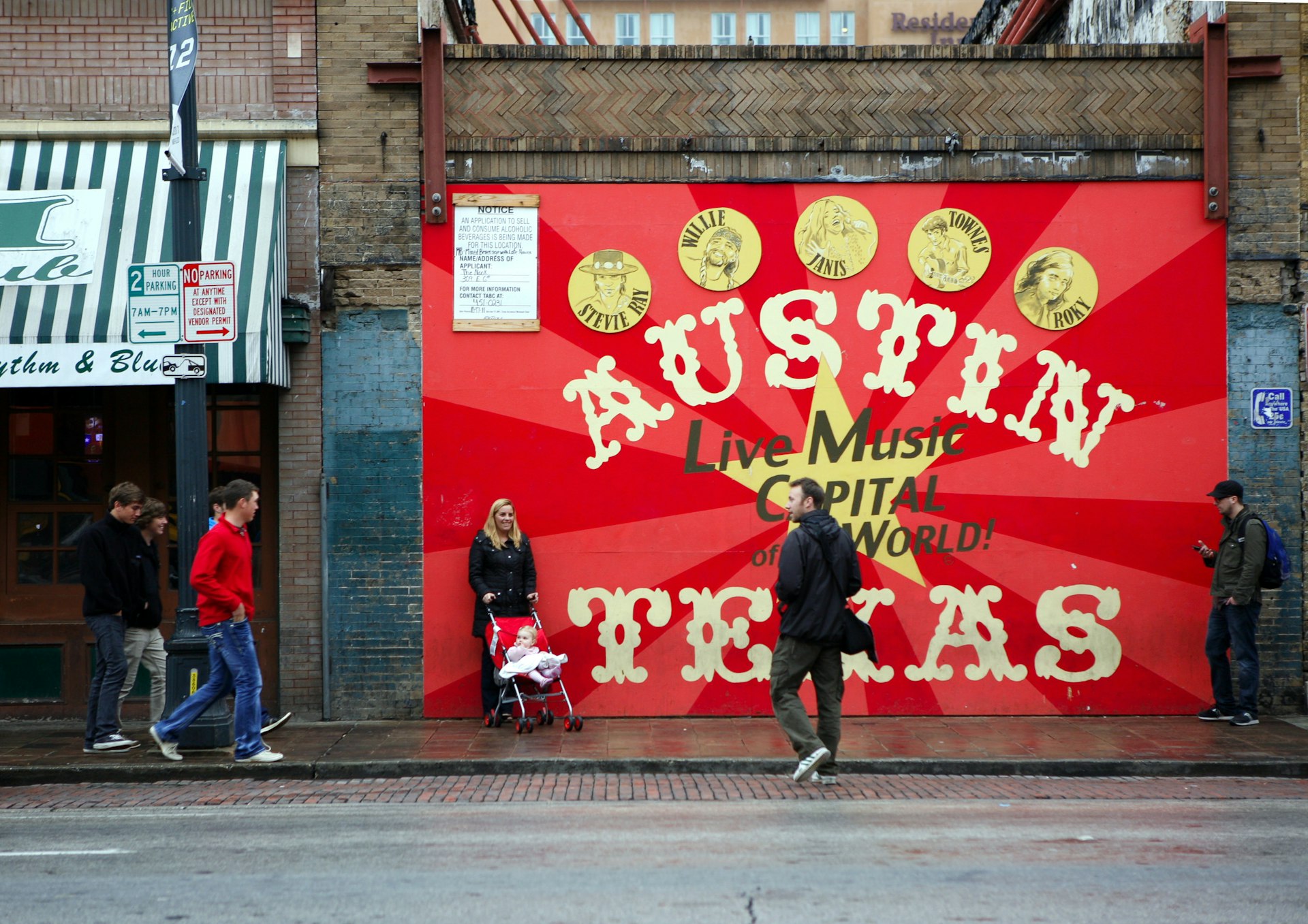 A large red painted panel on a wall declaring Austin the live music captial