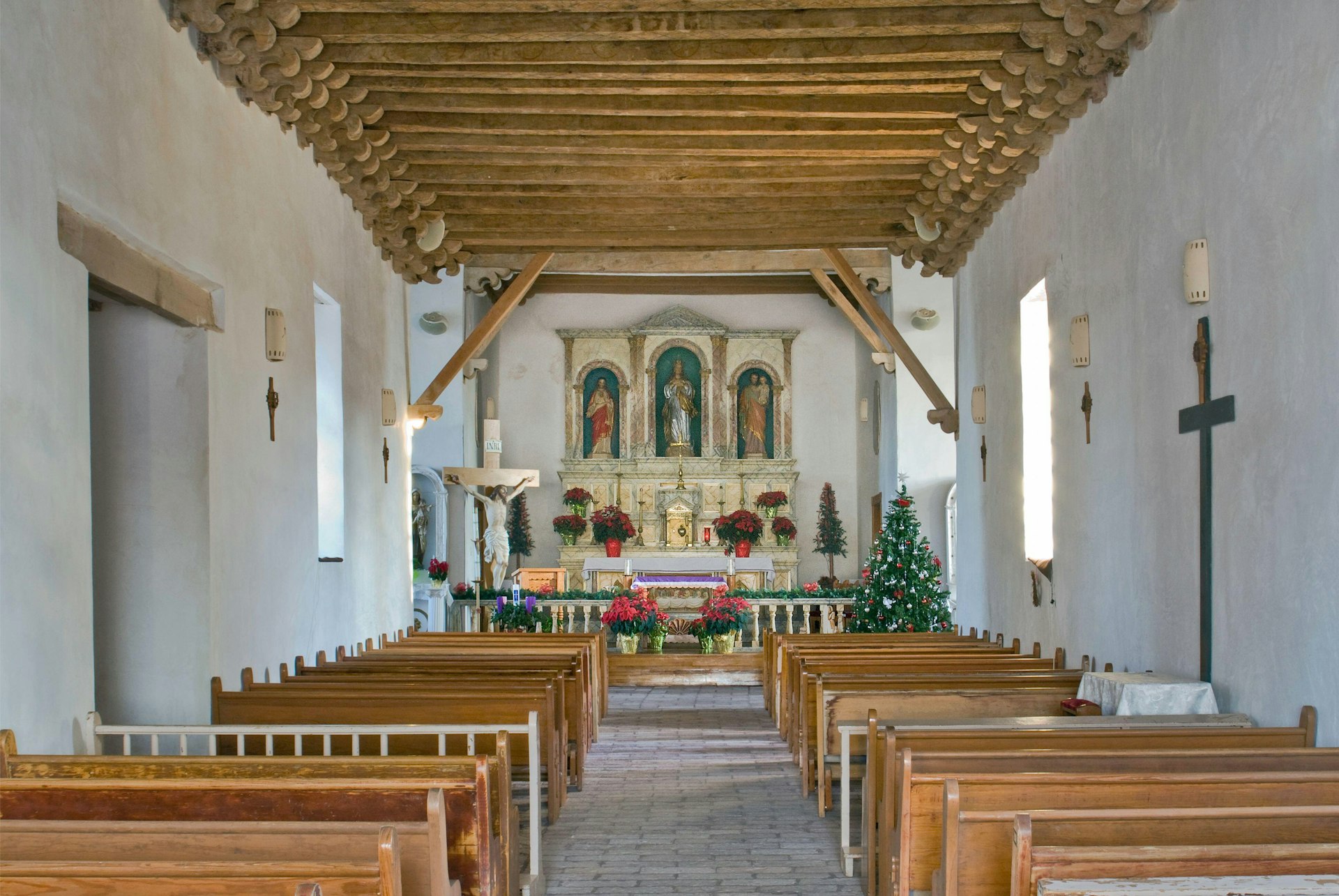 Church interior, decorated for Christmas, at Socorro Mission near El Paso, Texas, USA