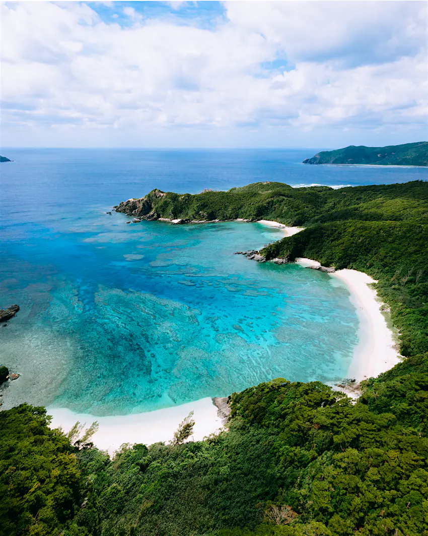 Aerial view of tropical island beach with clear blue water, Okinawa, Japan Aerial view of tropical island beach with clear blue water, Okinawa, Japan