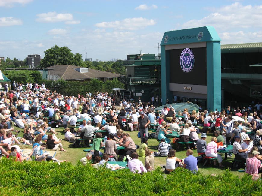 Crowds gathered to watch tennis on a large screen