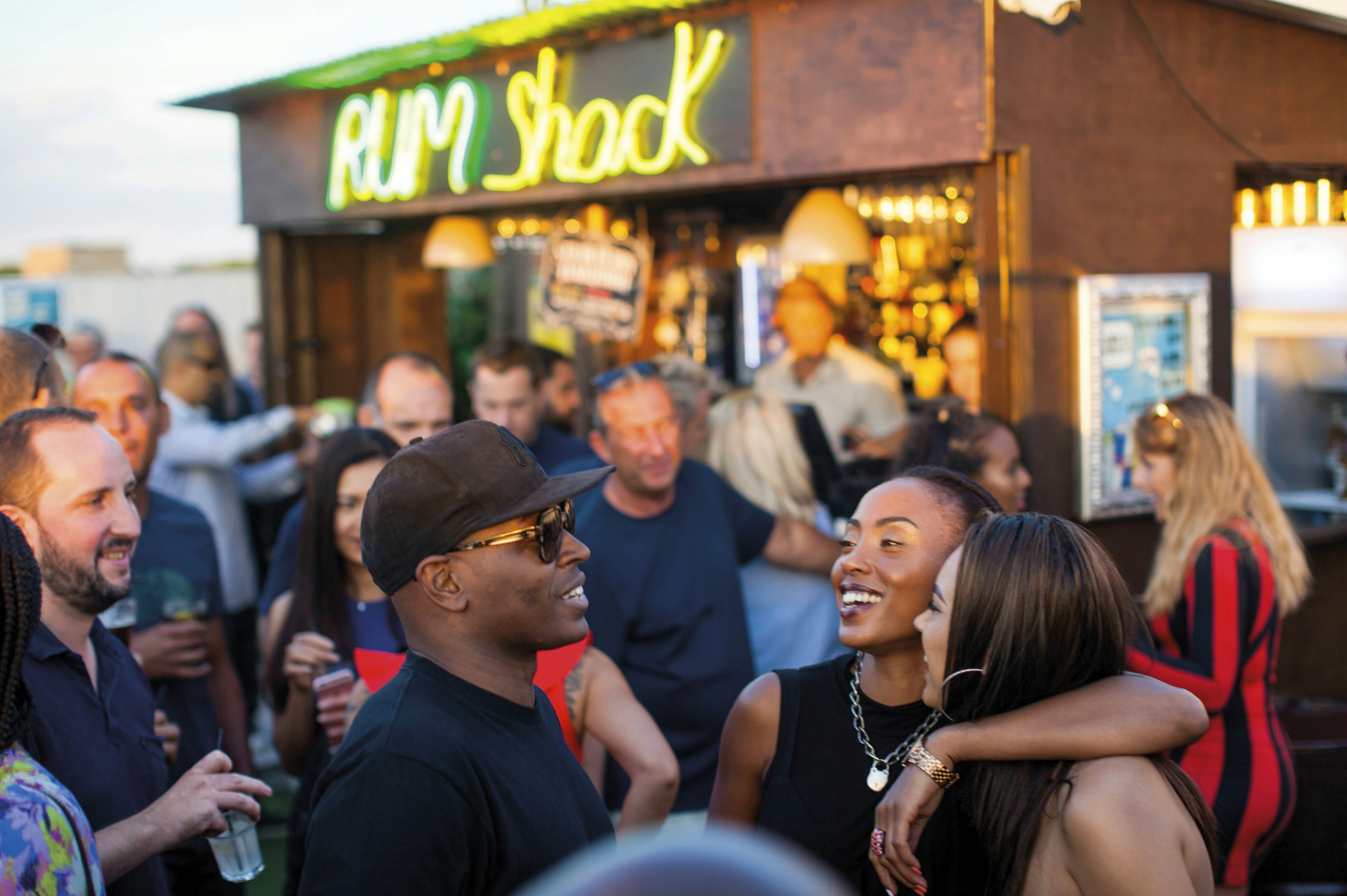 A group of people enjoying their time at a bar