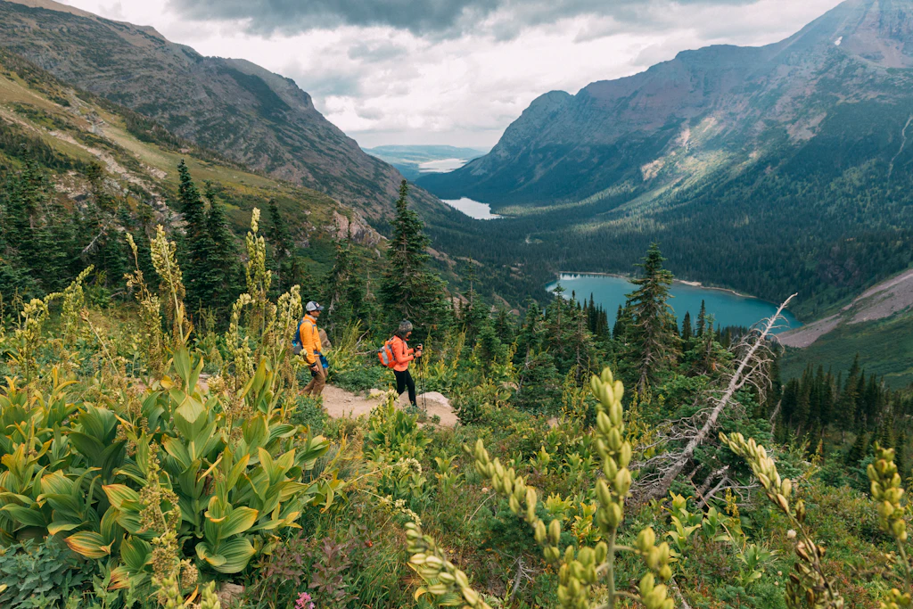 Couple hiking, Glacier National Park, Montana, USA Couple hiking, Glacier National Park, Montana, USA