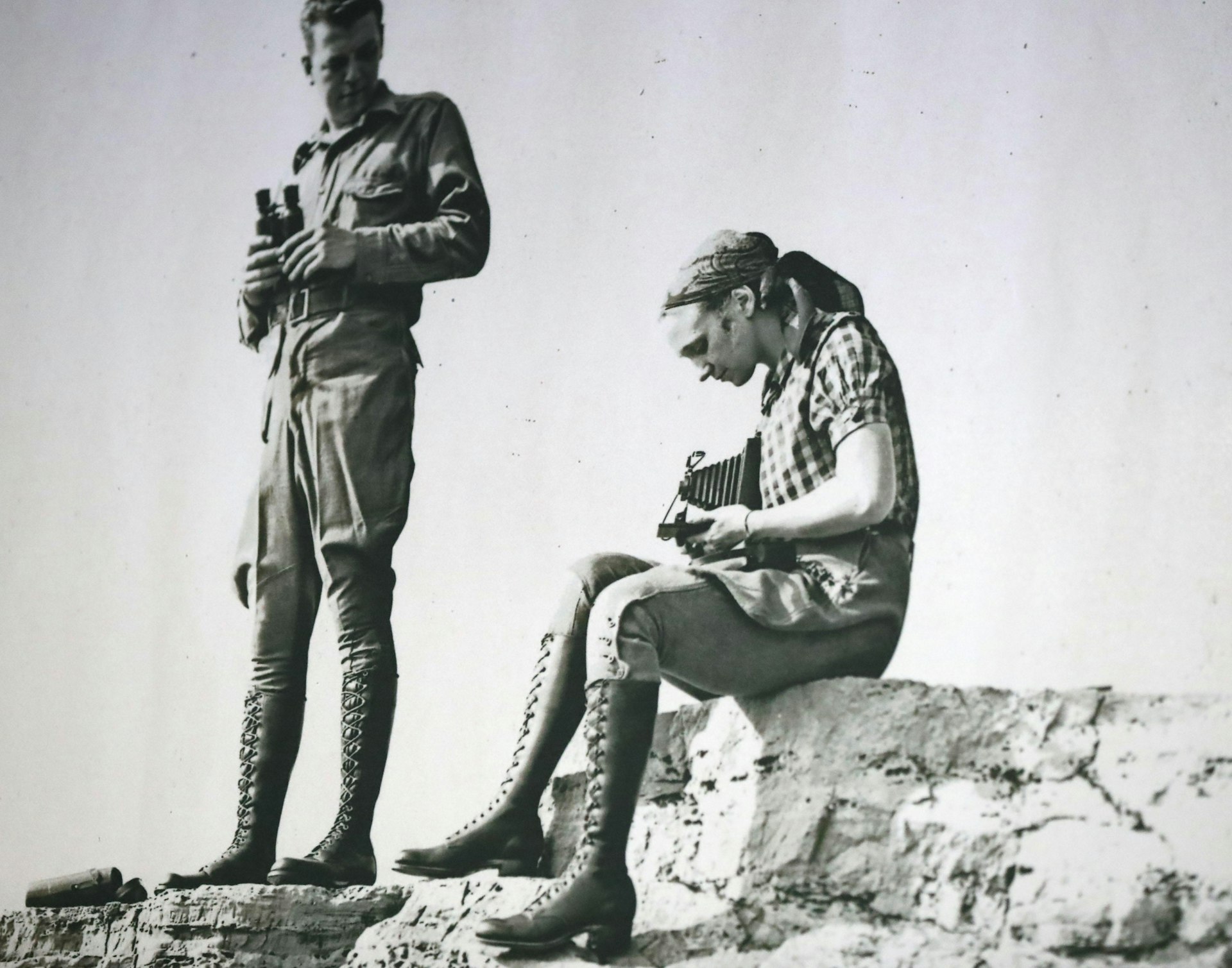 A vintage photo from the 1920s showing a woman wearing a pair of Red Wing boots and seen at the Red Wing Shoes headquarters