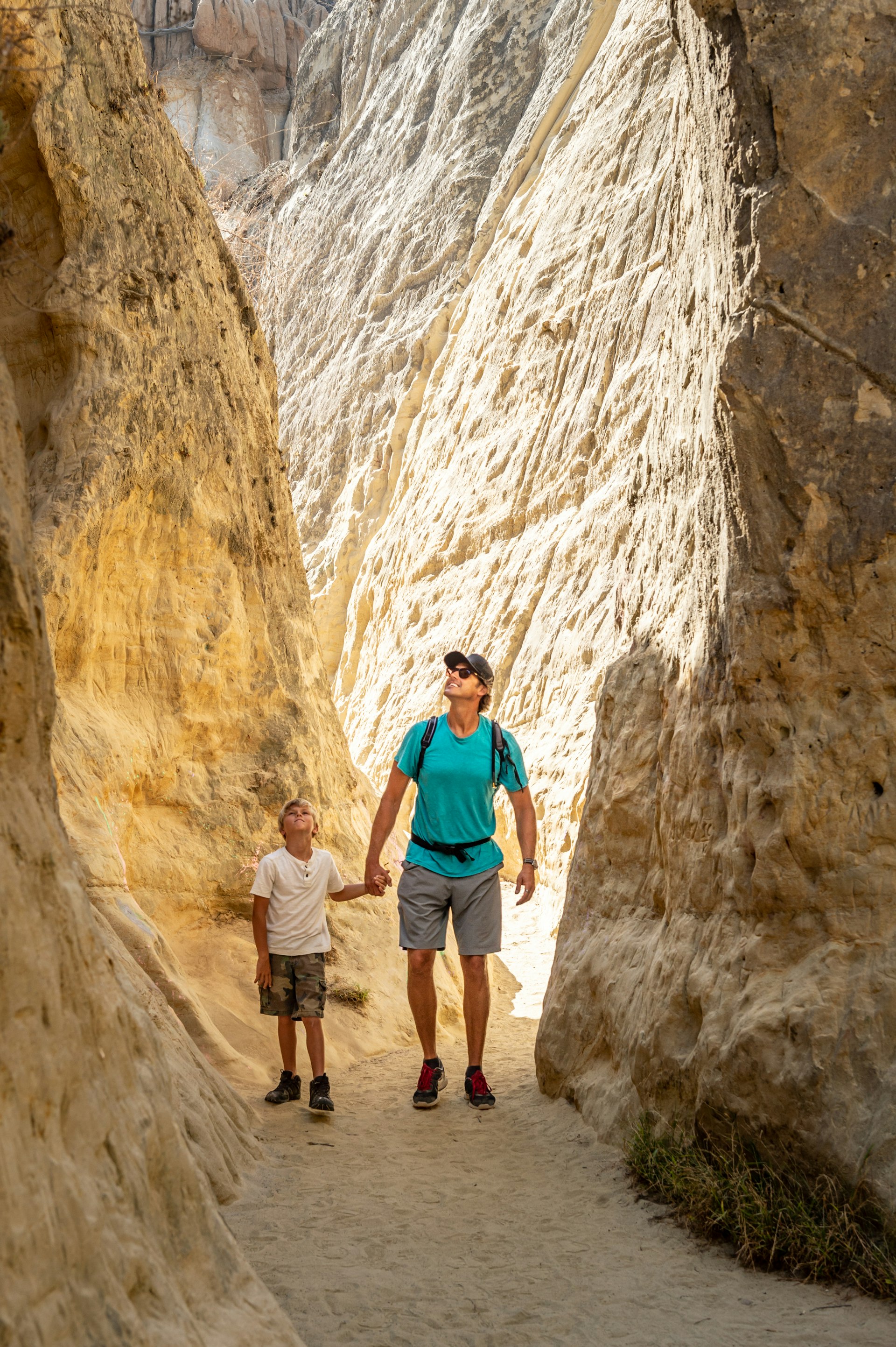 Dad and Son Hiking in a Canyon