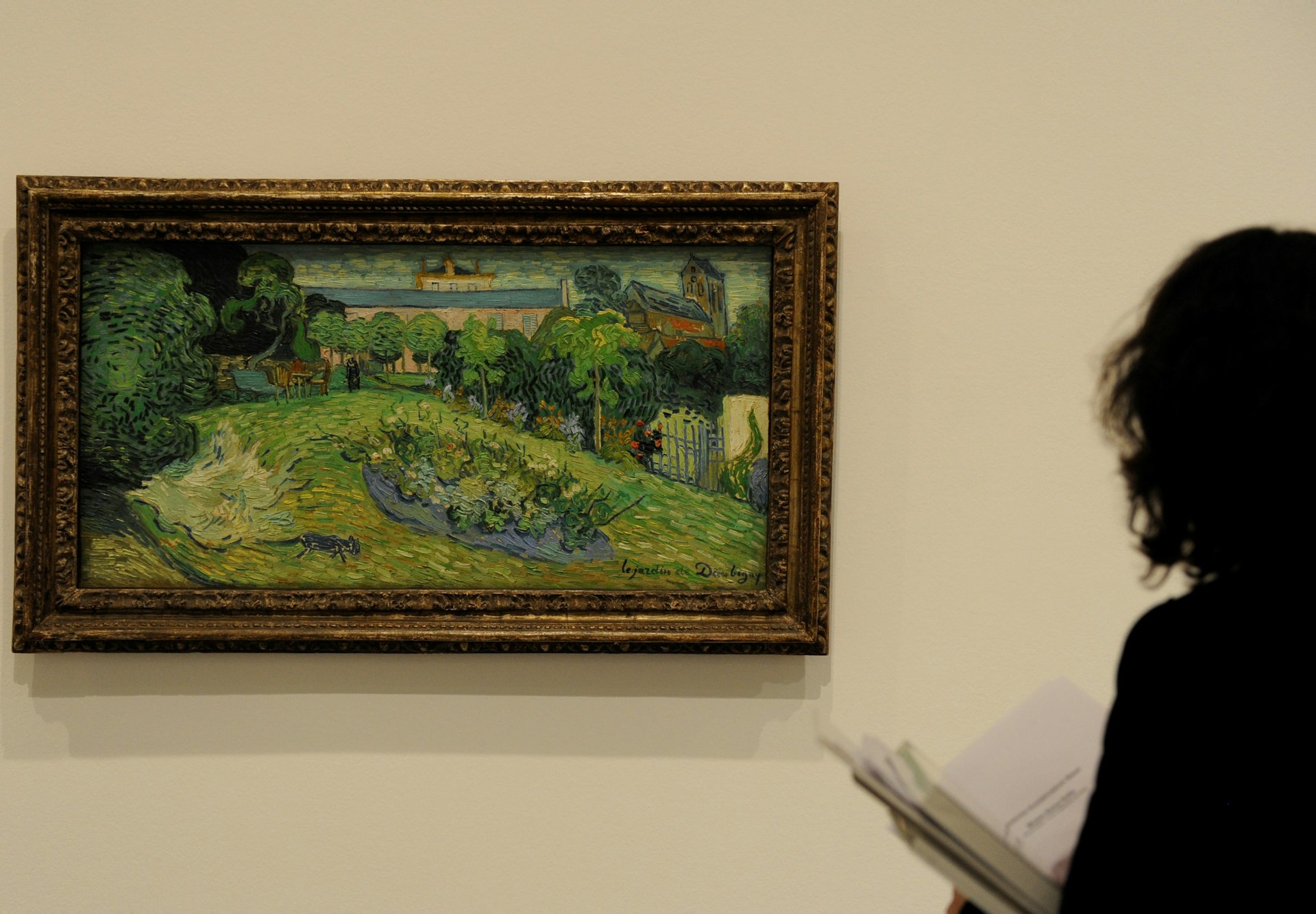 A visitor looks at the painting 'Le jardin de Daubigny' by Vincent van Gogh, which is on display at the Kunstmuseum Basel.