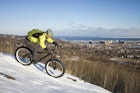 Man fatbiking on a trail in winter in Duluth, Minnesota