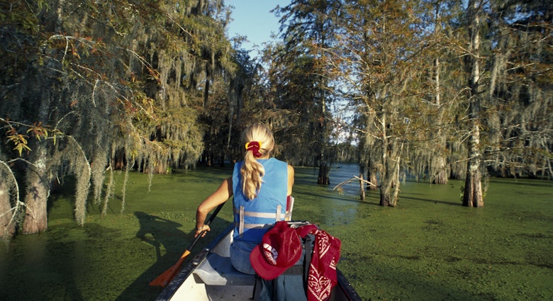 A woman canoeing on Lake Martin near Lafayette and Breaux Bridge.