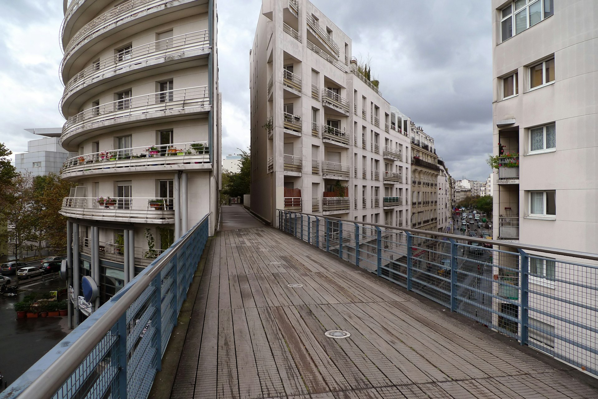 A pathway goes through a large building. 