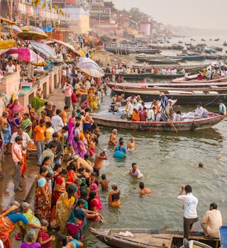 Varanasi, India - March 21: Hindu pilgrims take holy bath in the river ganges on the auspicious Maha Shivaratri festival on March 21, 2013 in Varanasi, Uttar Pradesh, India