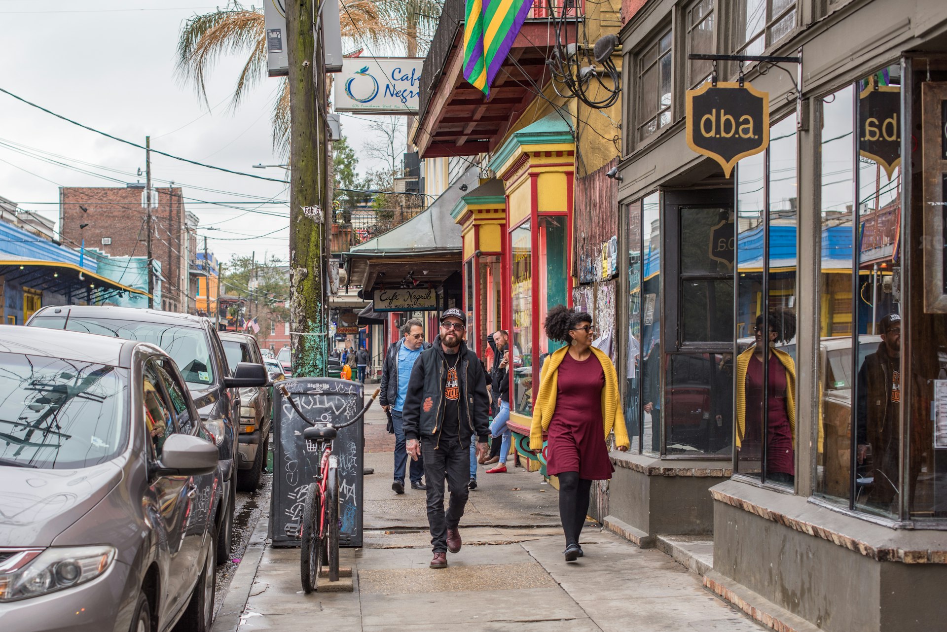Stylish couple walks along Frenchmen Street in New Orleans