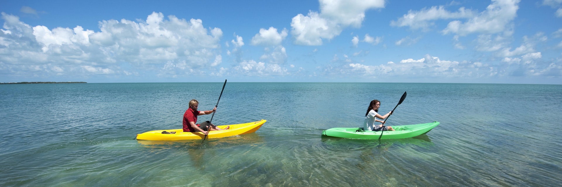 Man and a woman in kayaks at Key West.