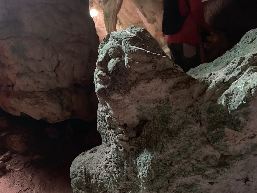 Closeup of a sculpture of a woman's face inside Hamilton's Cave, Long Island 