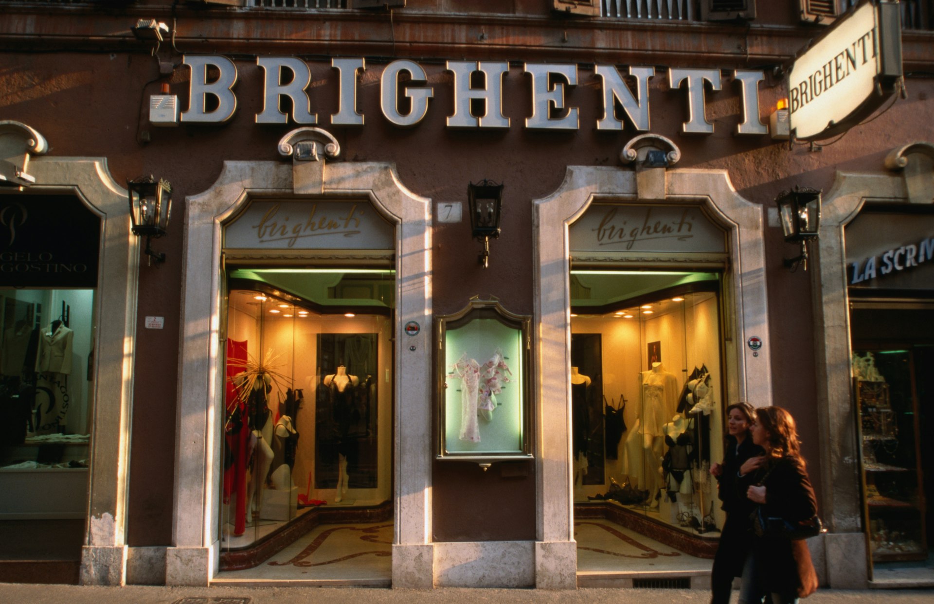 Shoppers walk by Brighenti in Rome.