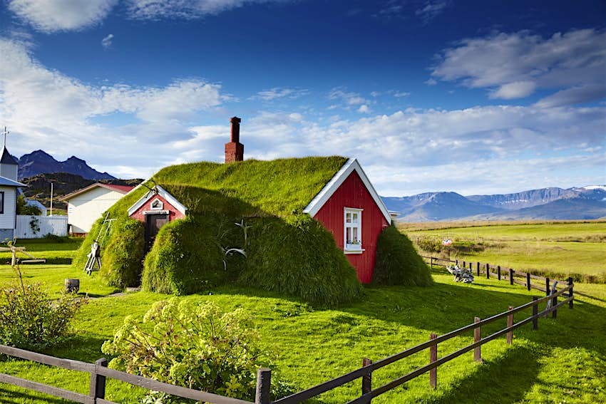 Alfheimar, meaning 'elf’s home', a series of red-painted farm cabins lined along the seafront in Borgarfjörður Eystri.