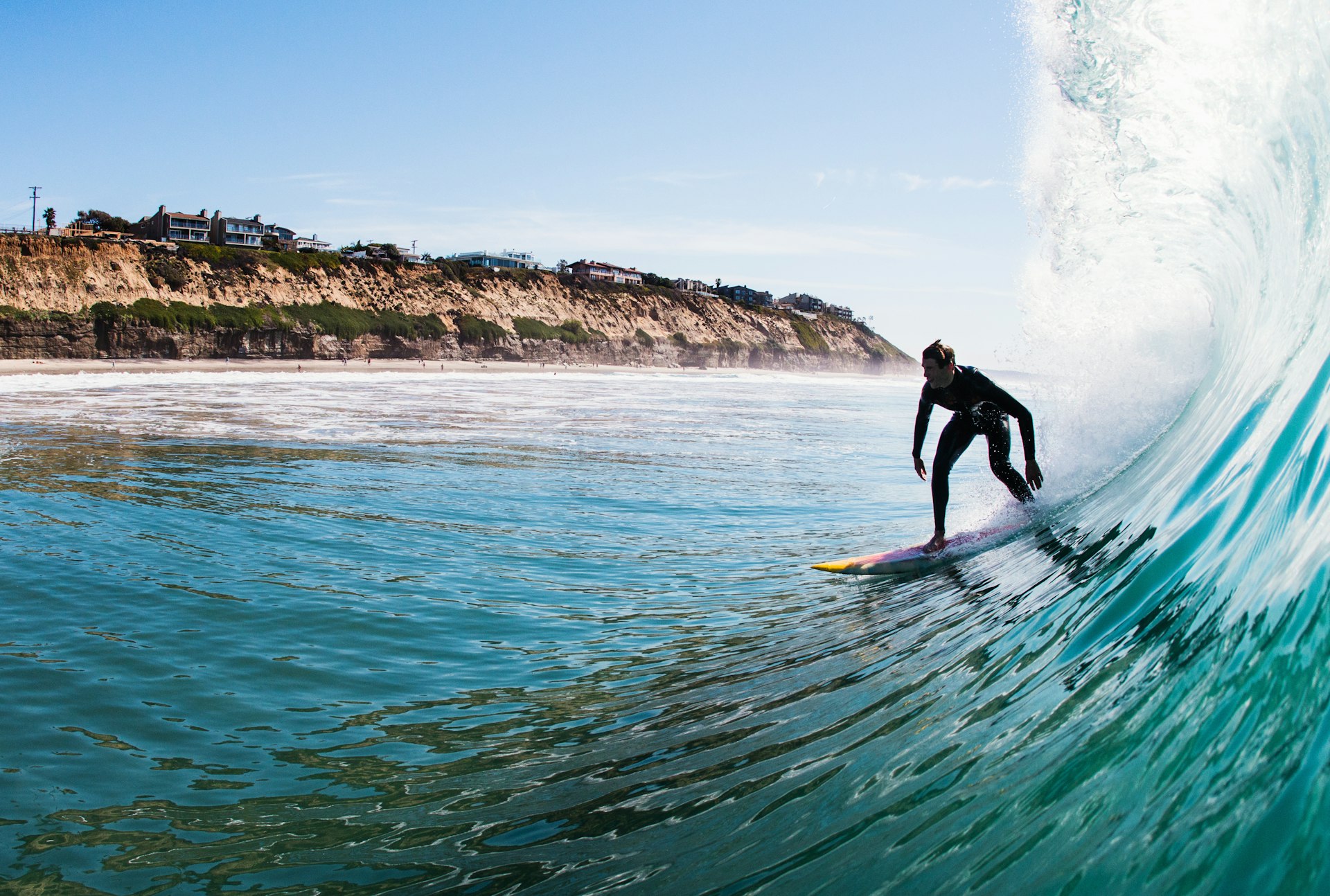 Young man surfing a wave, Encinitas, California, USA