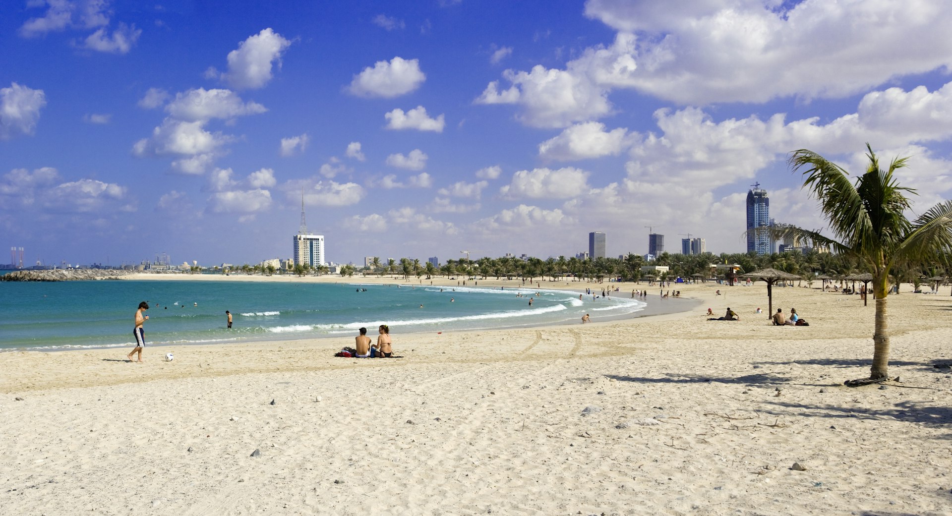 Visitors relaxing at Al Mamzar Beach Park in Dubai, United Arab Emirates