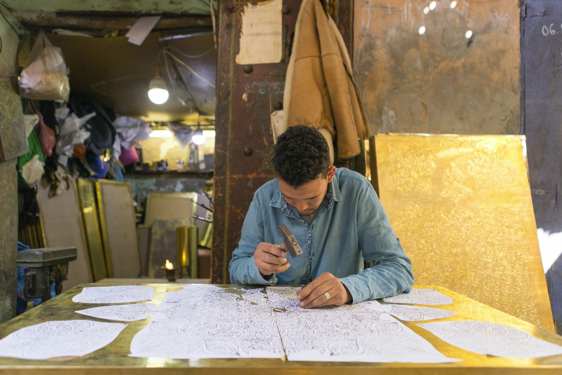 Metal artisan working in Marrakesh market, Morocco