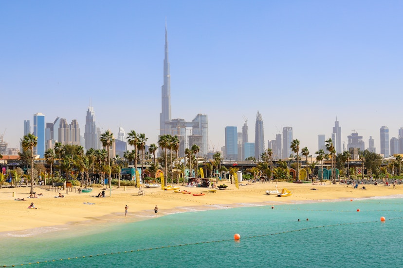 Dubai beach La Mer, people rest, in the distance the skyscrapers of the city. United Arab Emirates Dubai March 2019