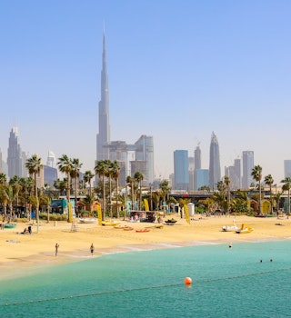 Dubai beach La Mer, people rest, in the distance the skyscrapers of the city. United Arab Emirates Dubai March 2019