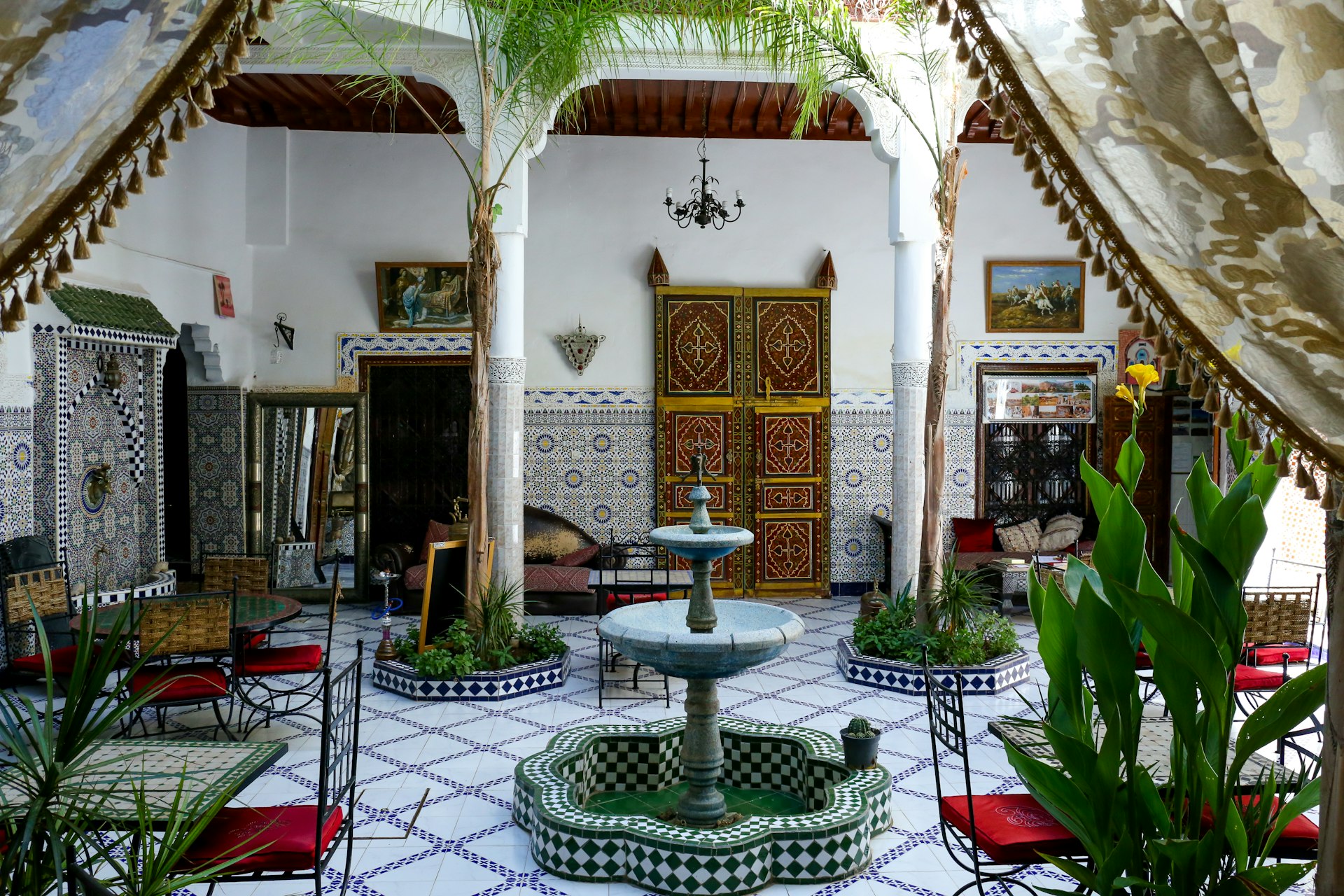 Tables and chairs inside a riad in Marrakesh, Morocco