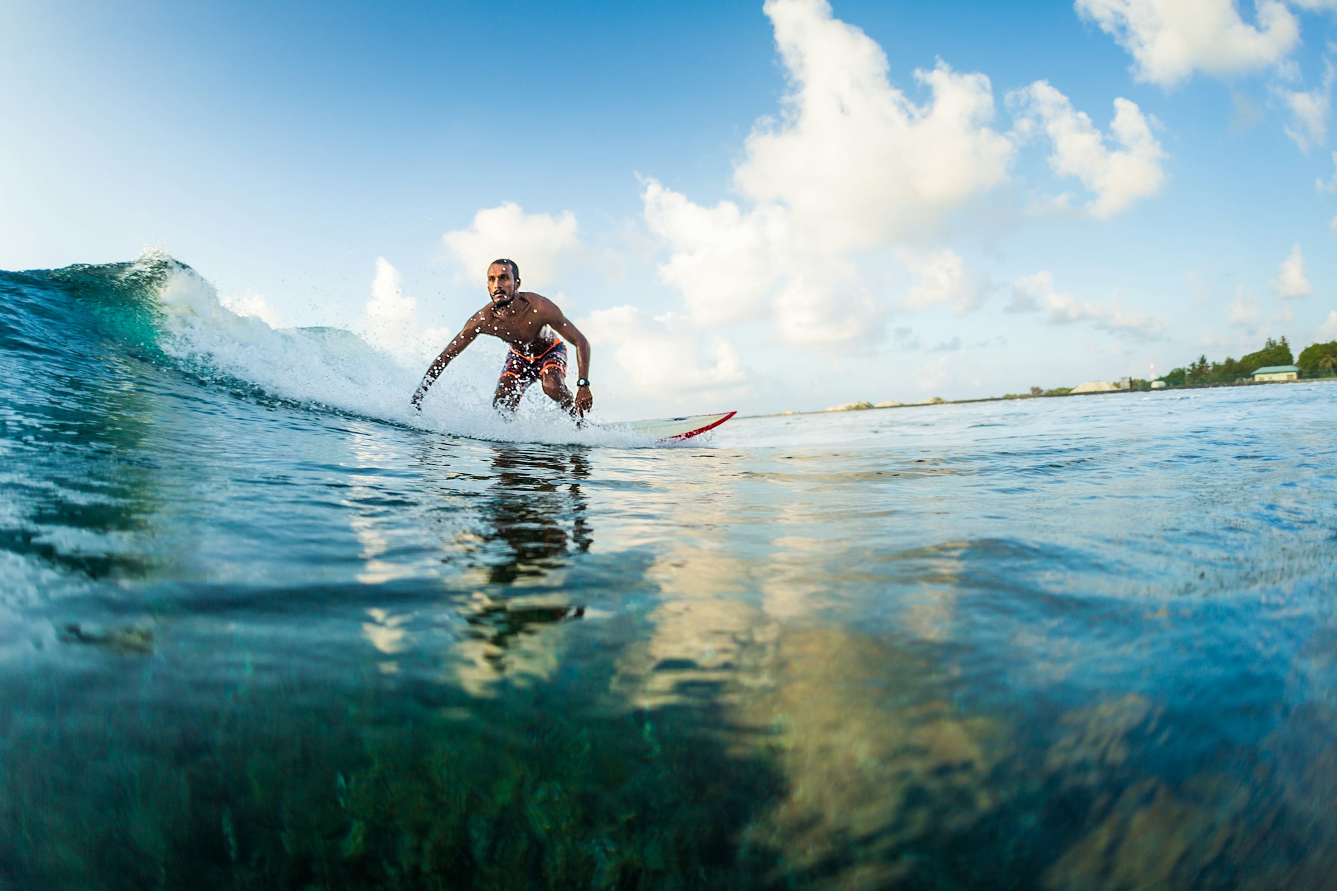 A surfer rides a waves. 