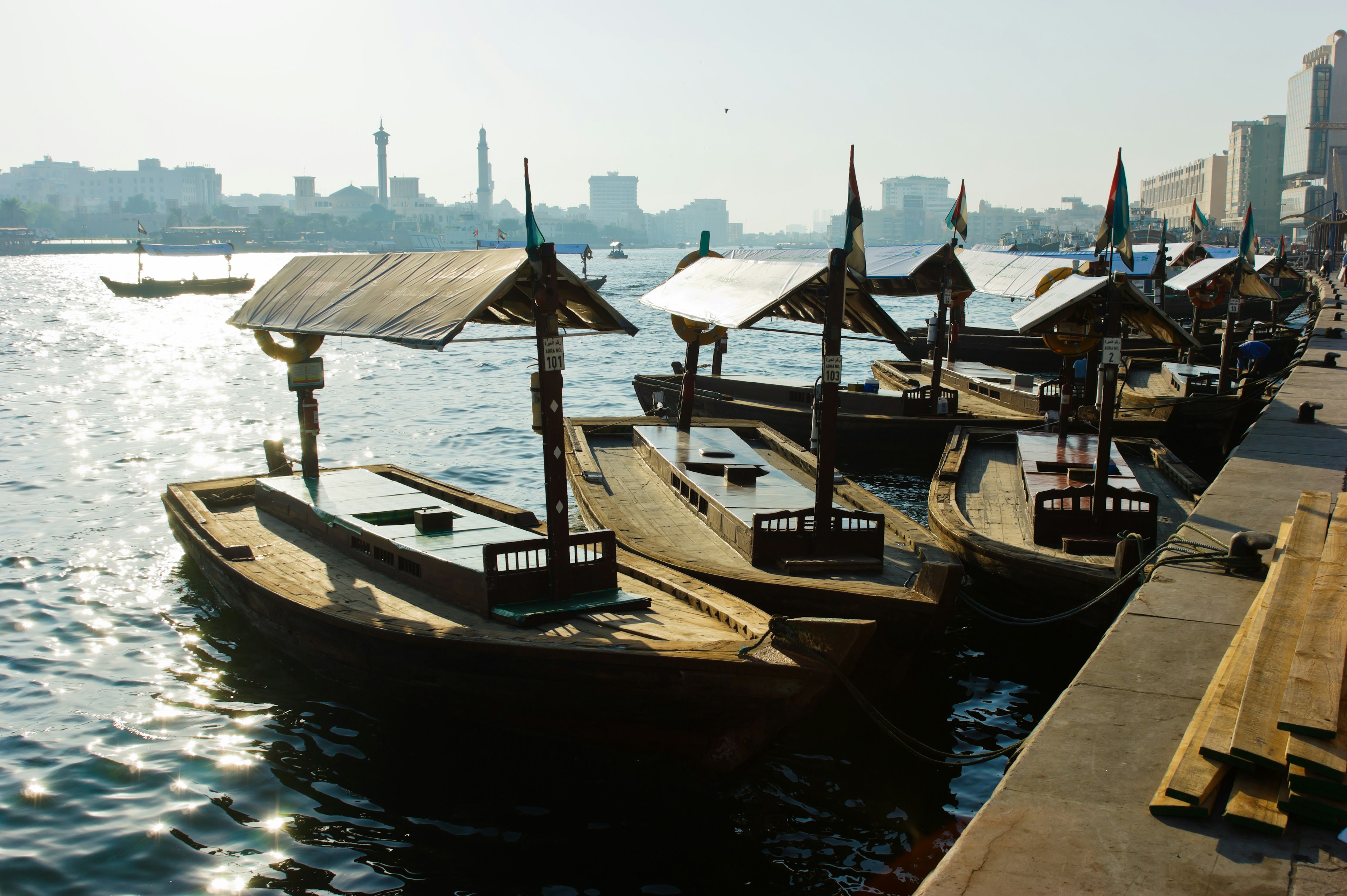 Abras sit in the water in Dubai Creek