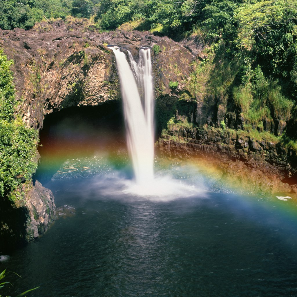 Rainbow forms near the base of Wailua Waterfall.