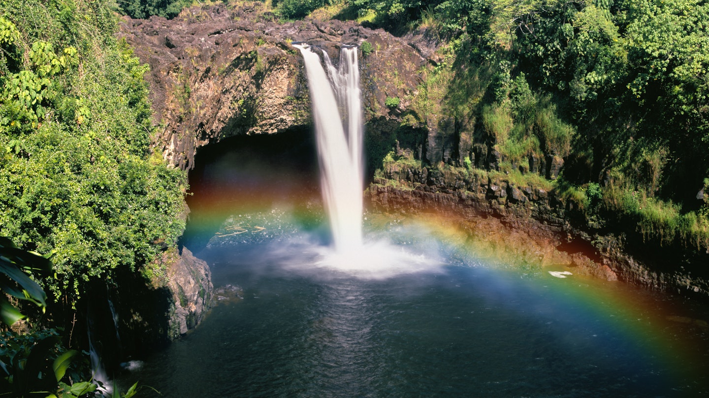 Rainbow forms near the base of Wailua Waterfall.