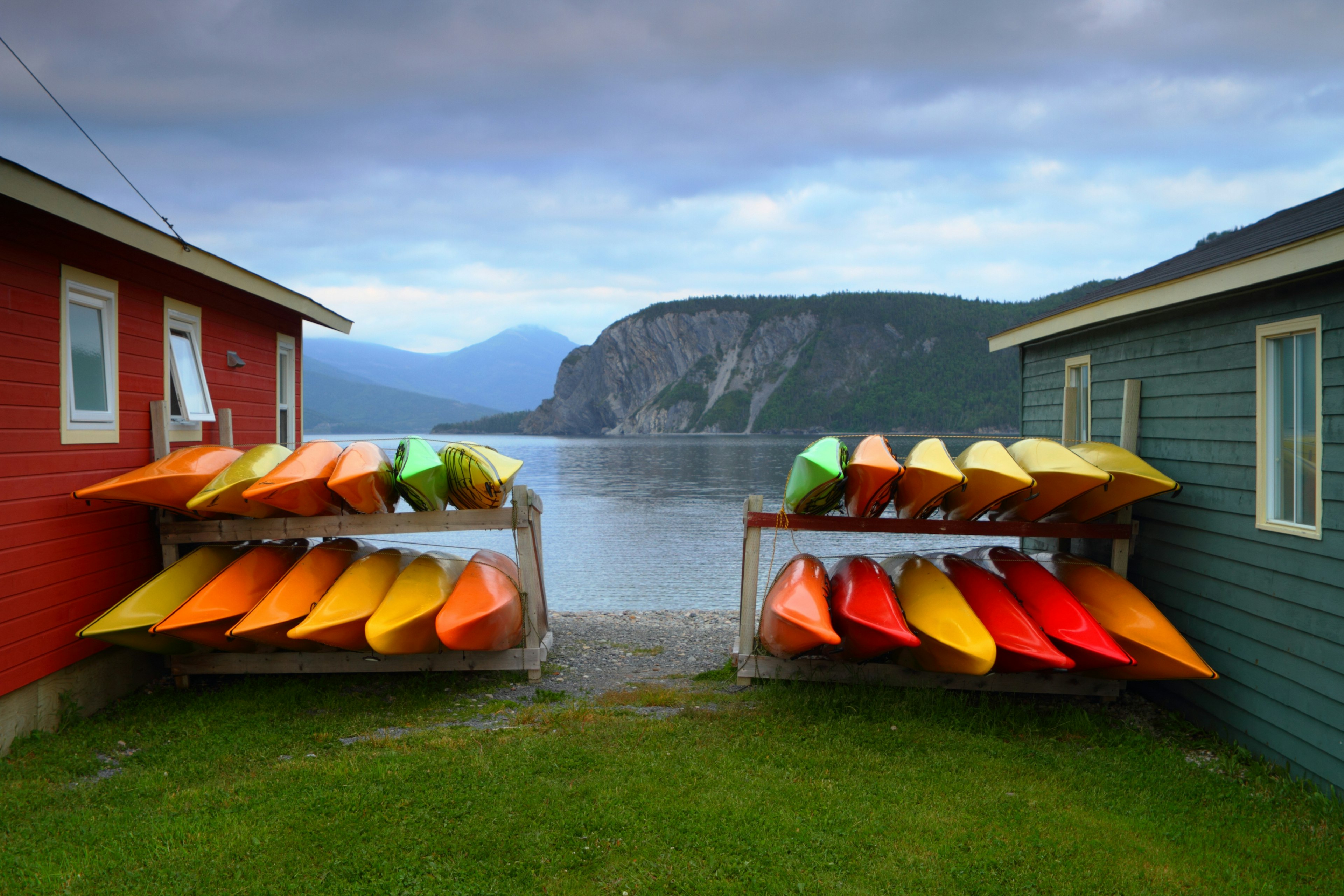 Stack of multi-colored kayaks in Gros Morne