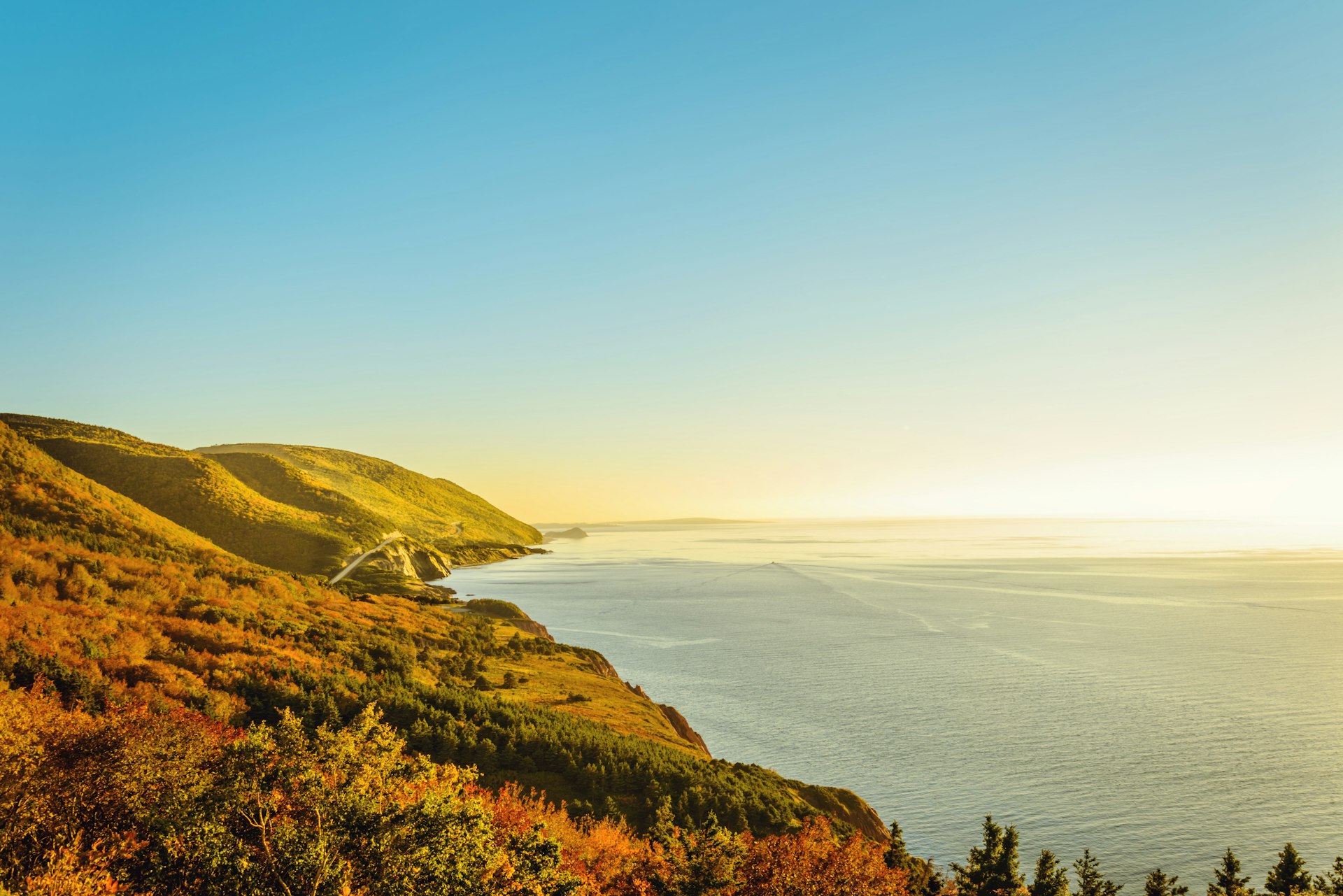 A coastal stretch of countryside, with fall colours in all the trees