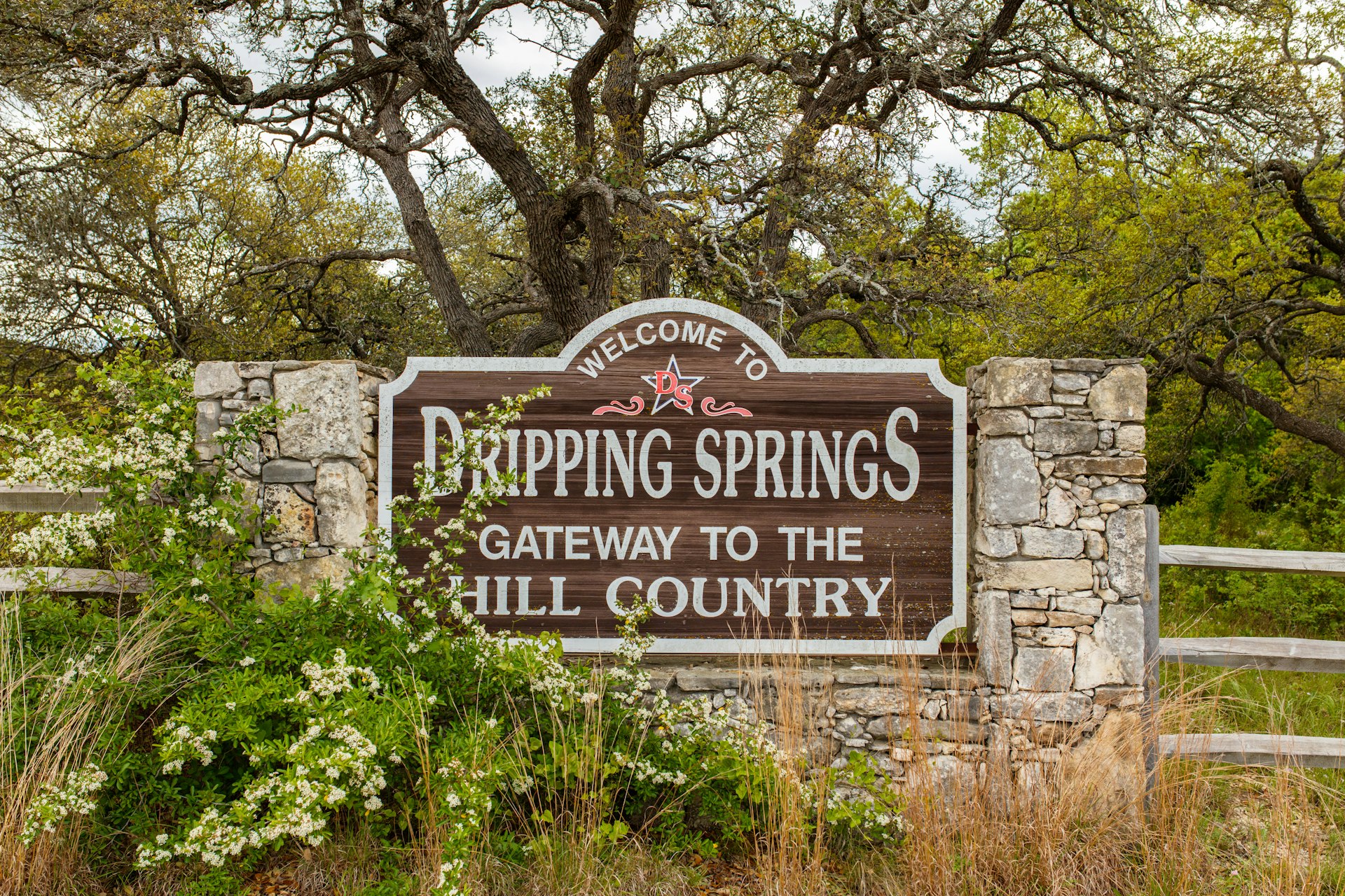 Welcome to Dripping Springs sign from this small town in the Texas Hill Country