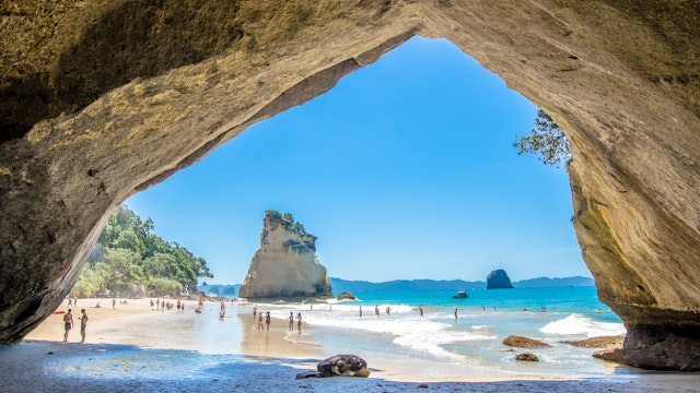 Coromandel,New Zealand - January 24, 2016: Cathedral Cove in Coromandel Peninsula on the North Island of New Zealand. People can seen exploring around it.