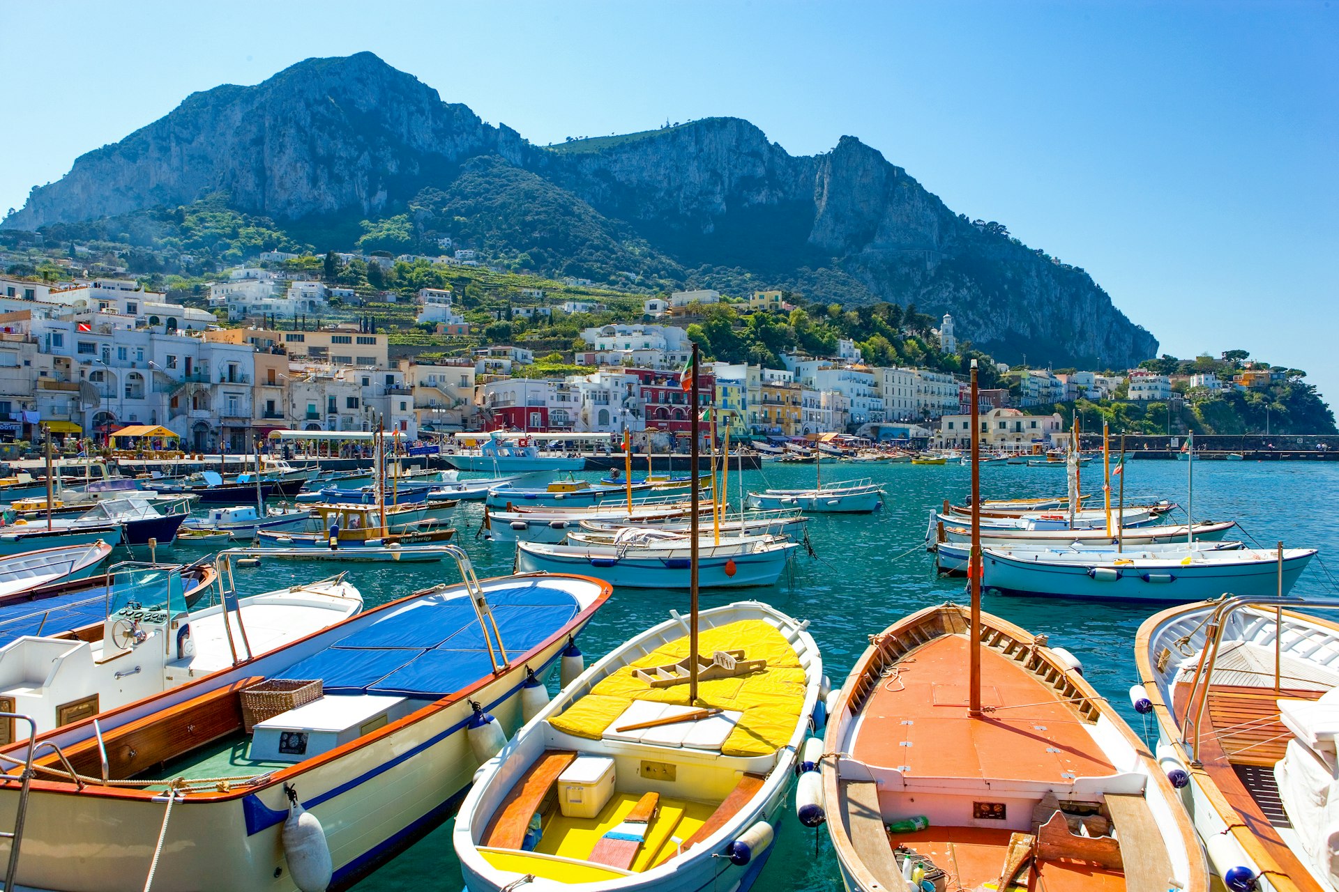 Colorful boats sit in the marina in Capri