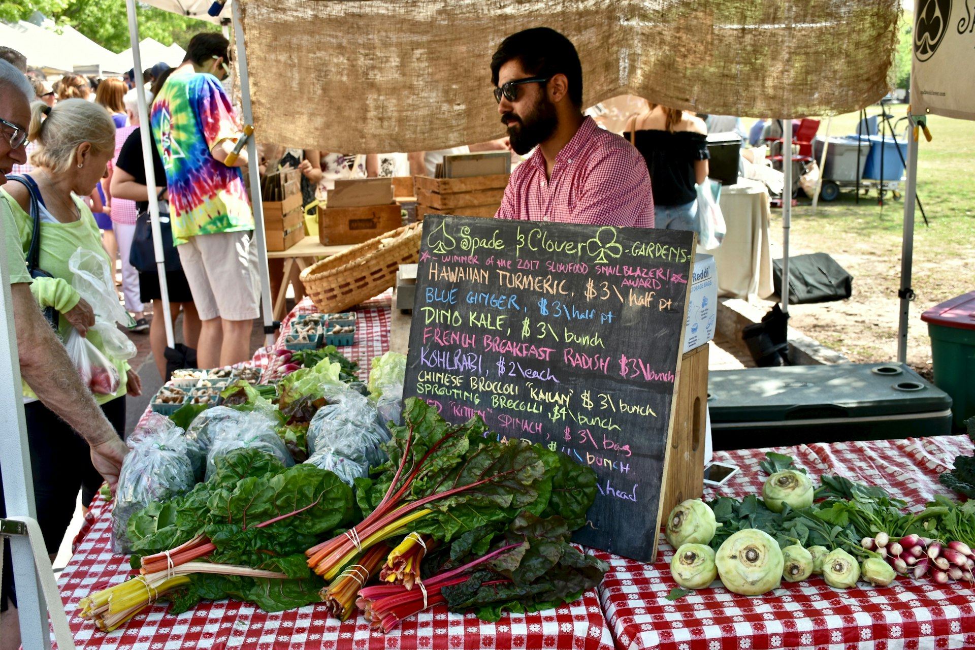 A seller sells his wares at the Charleston Saturday Farmers Market in historic Charleston South Carolina