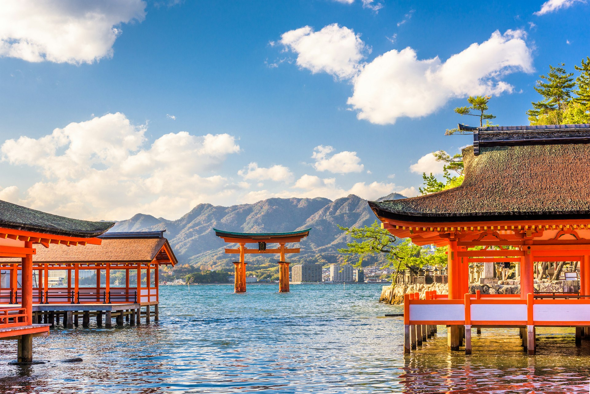The 'floating' torii gate of the Shinto shrine on the island of Itsukushima. The orange structure appears as if it is floating on the water.