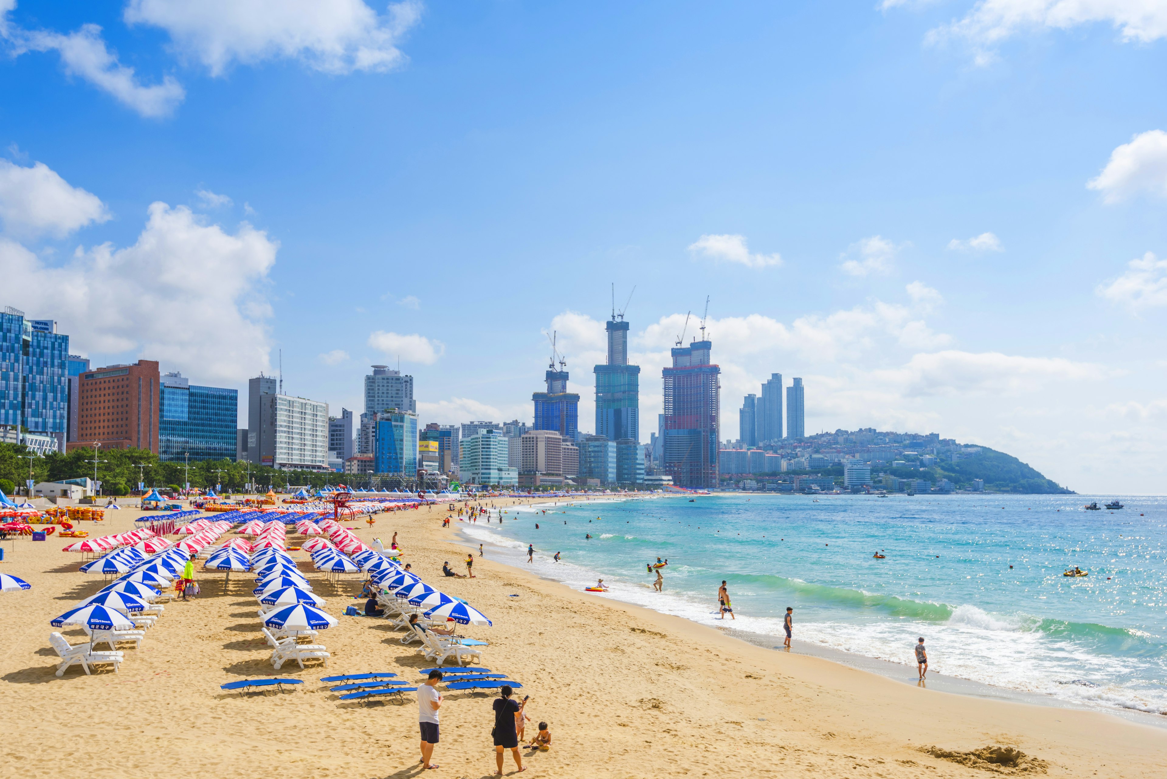 Rows of umbrellas on the sand at Haeundae Beach near Busan, Korea