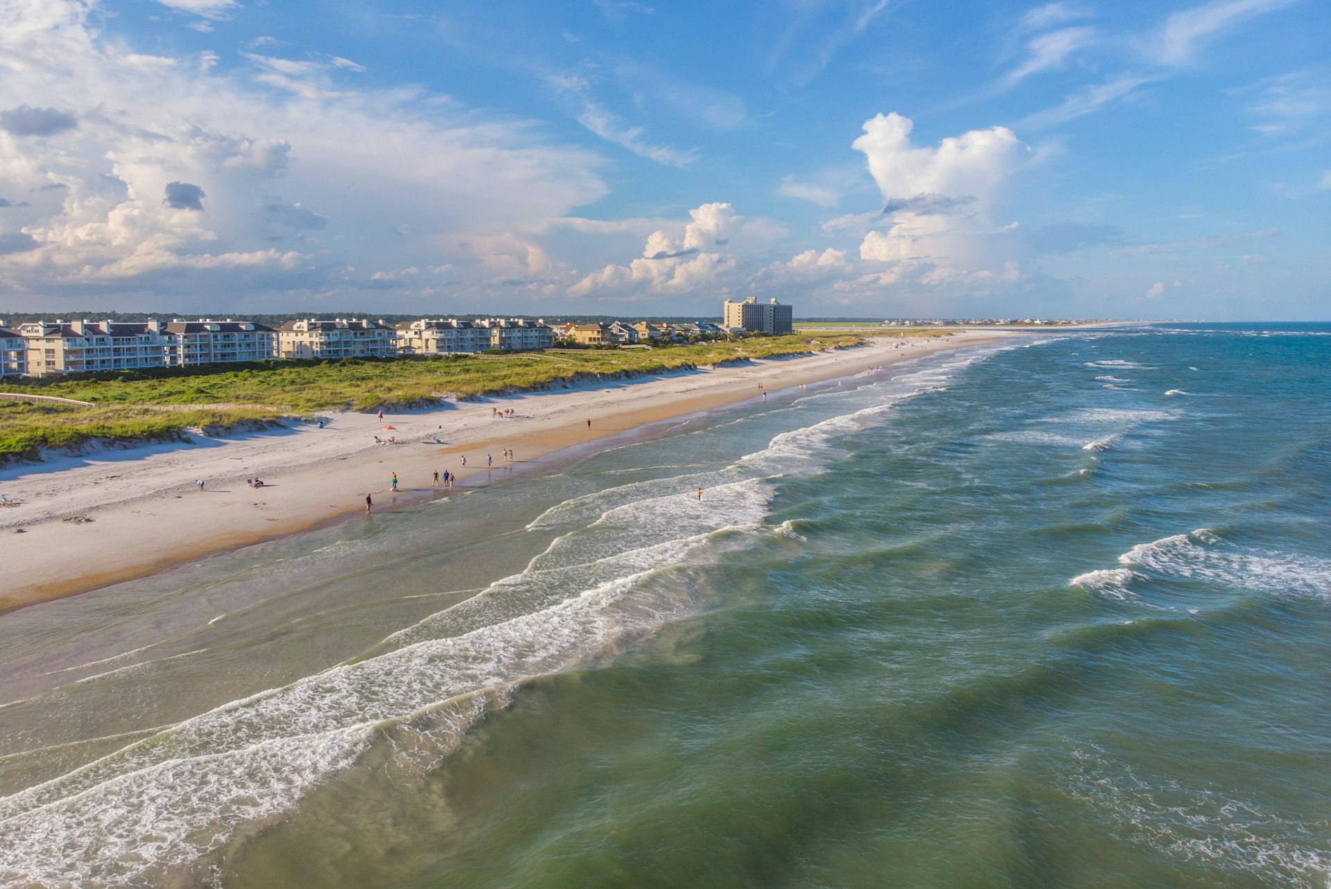 A high-angle view of a beach under a blue sky