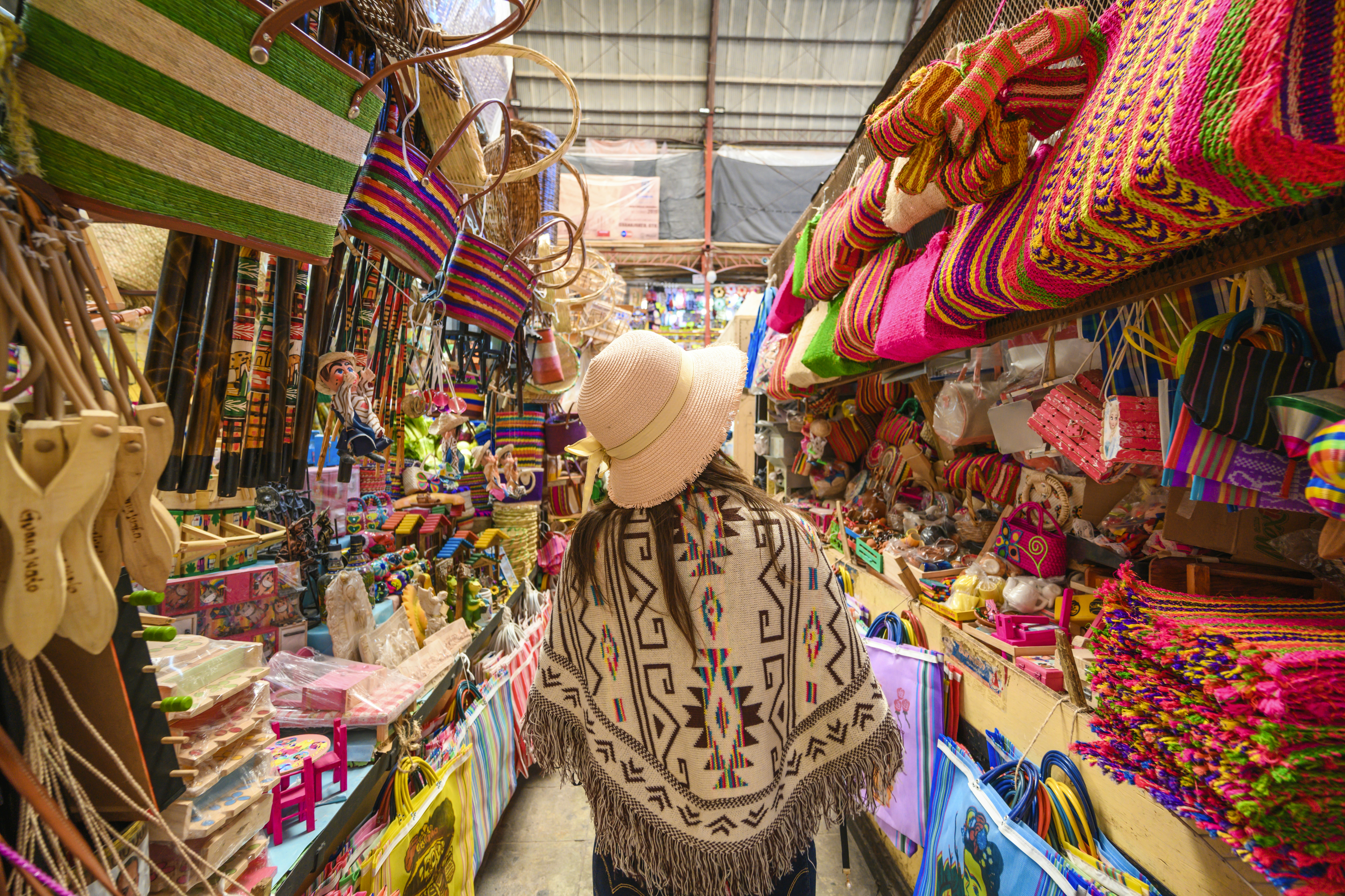 Tourist shopping for souvenirs at the Hidalgo market in Guanajuato, Mexico